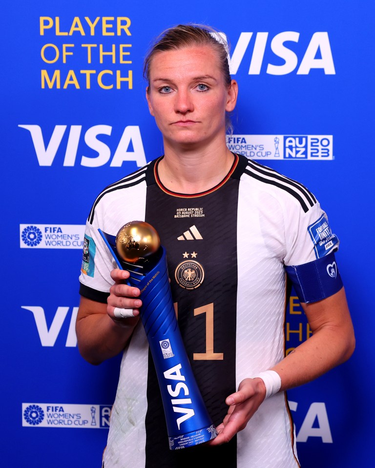 Popp poses for a photo with her Player of the Match award