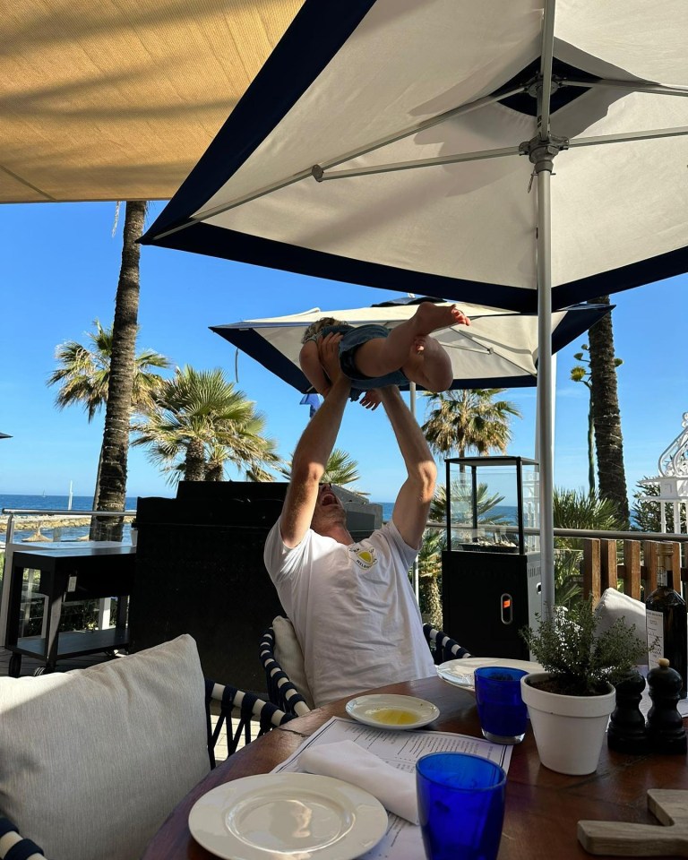 Andy Murray with one of his children during a family vacation