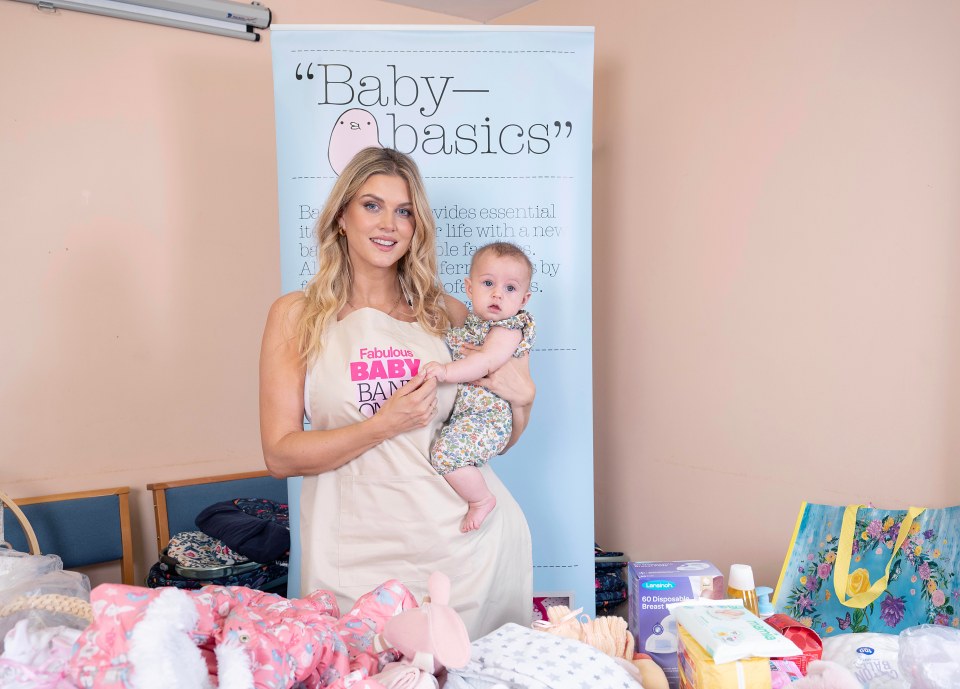 Ashley, pictured with daughter Ada, helped fold clothes at the baby bank