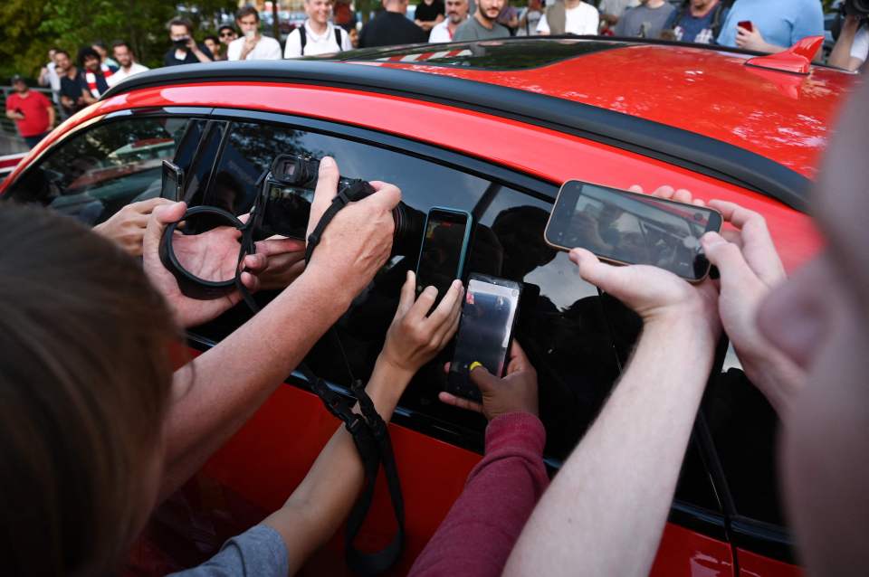 The England captain was mobbed by fans who gathered to welcome the superstar