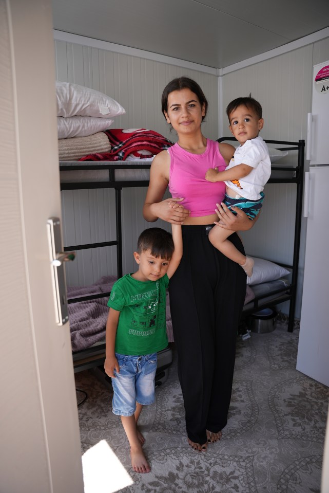 Hazal, 15, and her three-year-old brother Talha, and a neighbour's son, in the three-roomed shipping container that houses her family in Kahramanmara, close to the quake’s epicentre