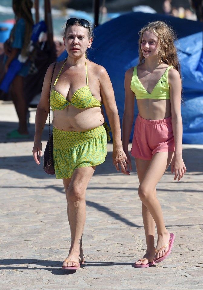 Flame wore a similar colour top to her mum as they headed out for another day of fun in the sun