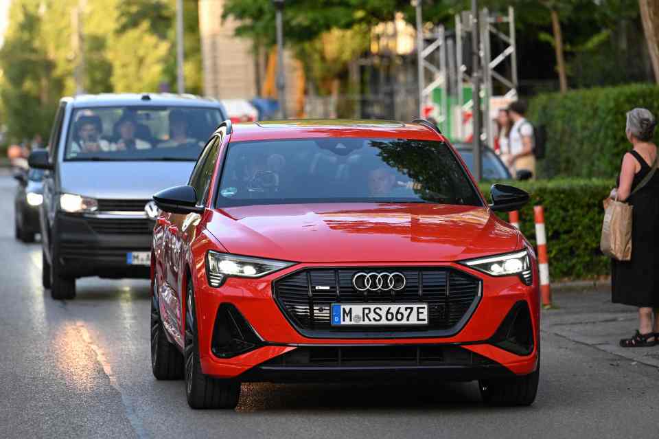 He was escorted from the airport in a red Audi