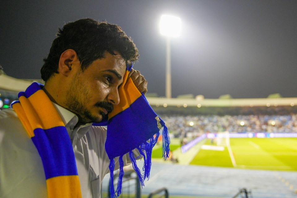 Fans were dabbing away sweat with their scarves in scorching temperatures