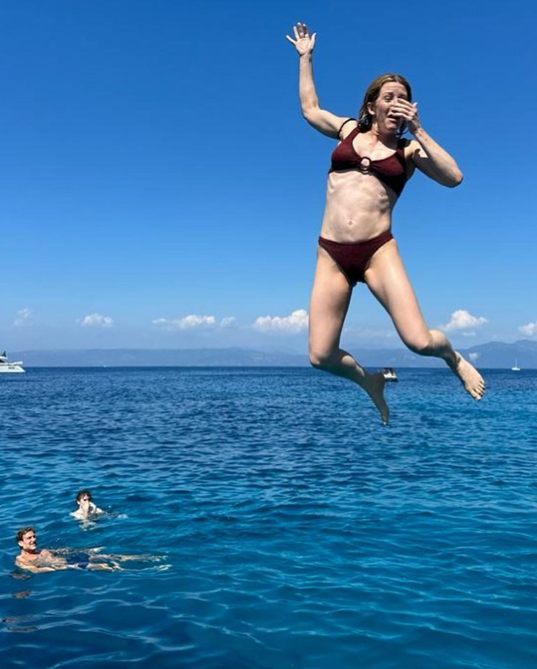 Ellie jumped into the ocean in a maroon bikini