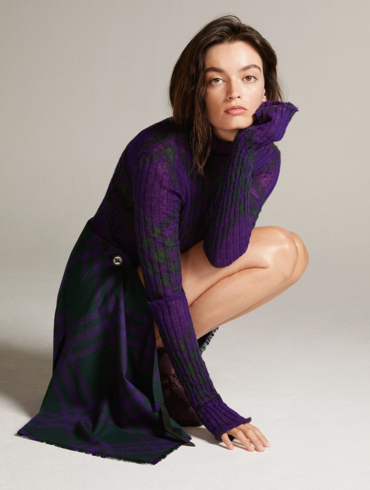 Emma McKay wore this tight purple knitted dress in this shoot for the latest issue of Elle magazine