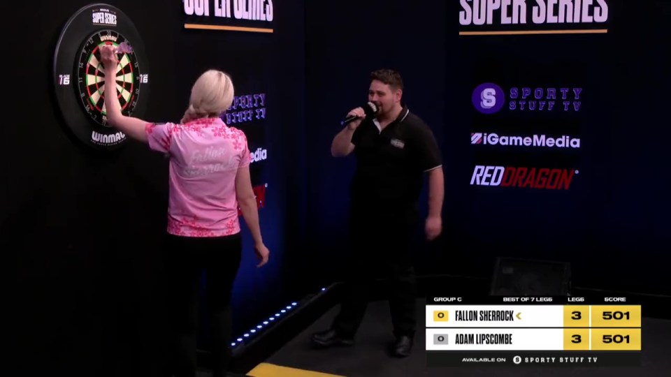 The history-making darts star was showered with compliments by the man on the mic