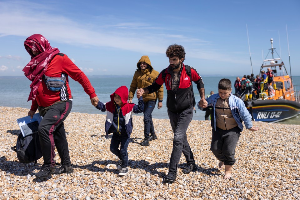 Families arrive on UK shores after making the dangerous journey