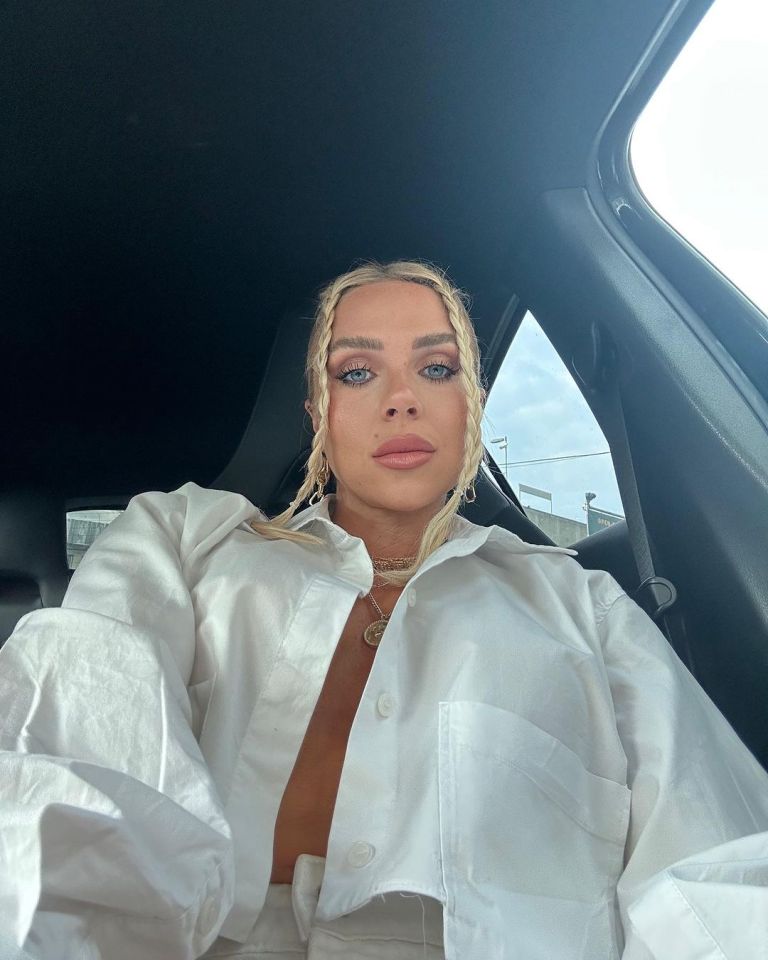 Gabby, 31, flashed a pout as she posed in her car