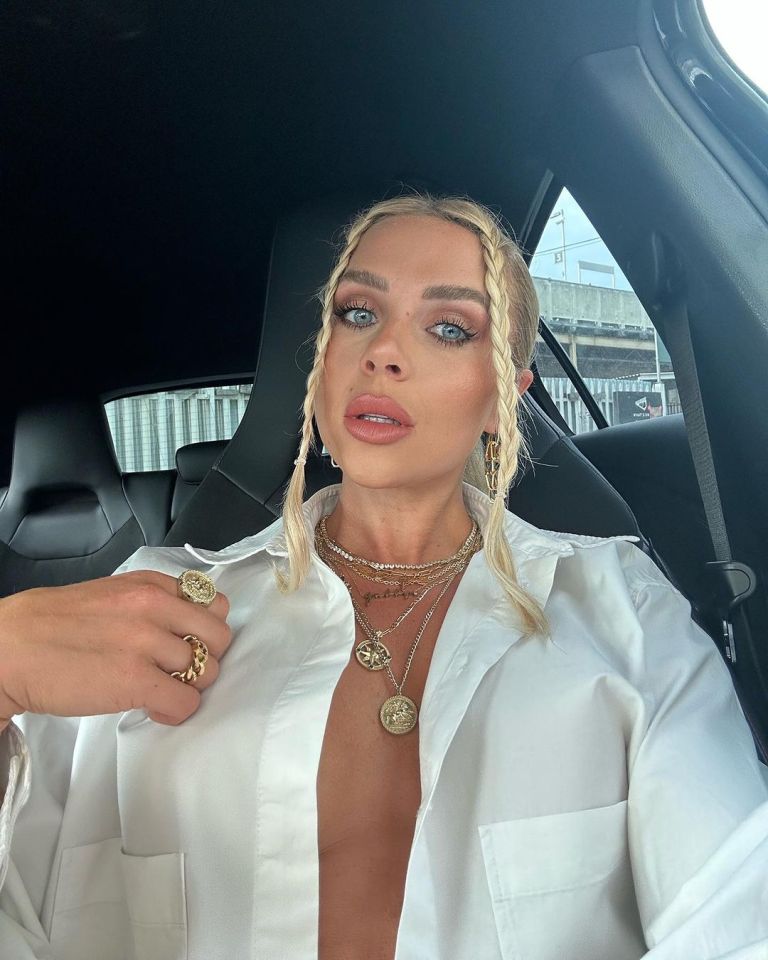 Gabby Allen went braless in a daring white unbuttoned shirt