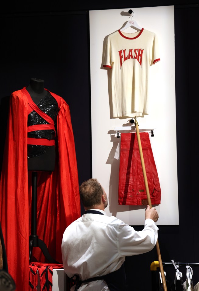 His white 'Flash' T-shirt from the 1981 world tour will sell alongside his red vinyl trousers for an estimated £20,000.