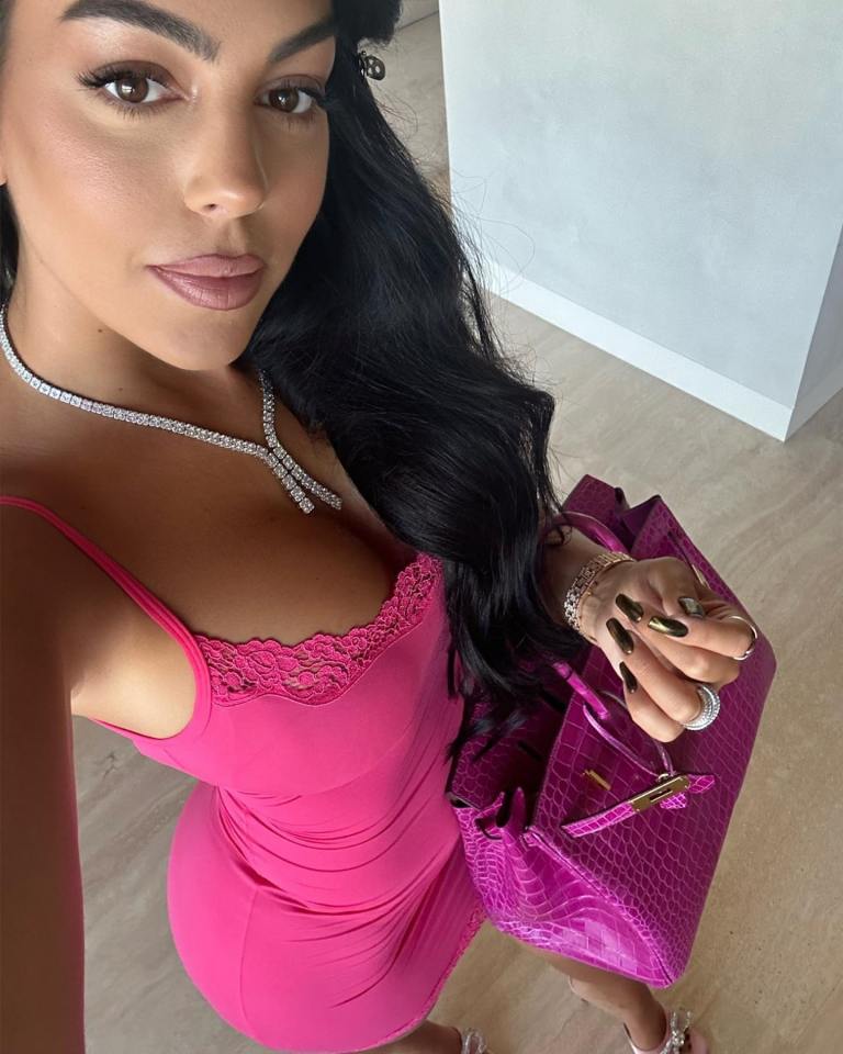 Social media star Georgina chose this dress with a controversial shade of bag to 'match' it as she continues to indicate she is enjoying Saudi life