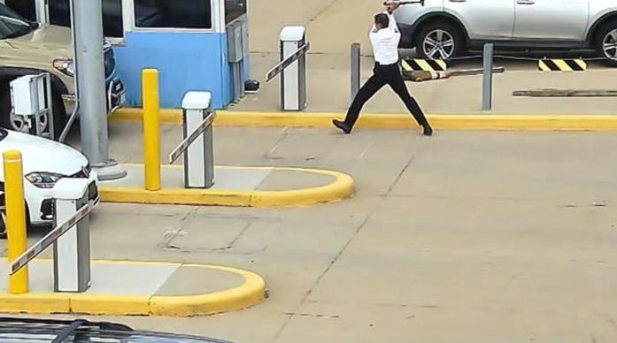 This is the shocking moment a United Airlines pilot attacked a parking arm with an axe