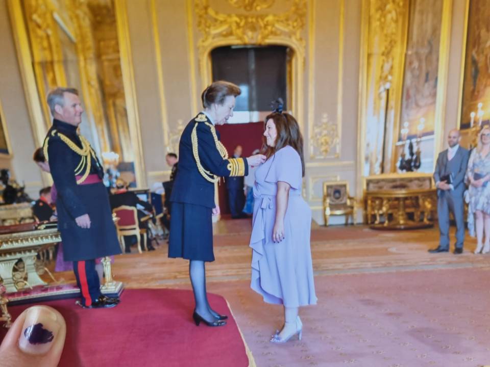 Bianca being awarded an MBE for services to vulnerable people, particularly refugees