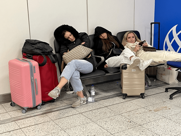 Passengers at Gatwick Airport waiting to board planes