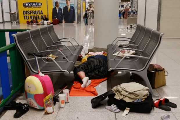 Tourists sleeping at Palma Airport in Mallorca