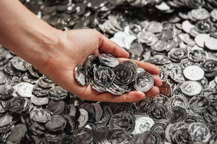 A new 50p coin bearing the face of King Charles is entering circulation today