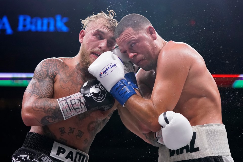 The boxers clinch after an exchange