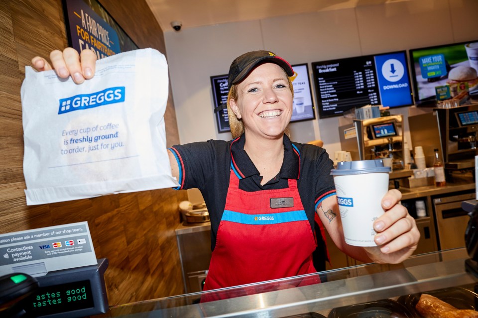 a woman holding a bag that says greggs on it