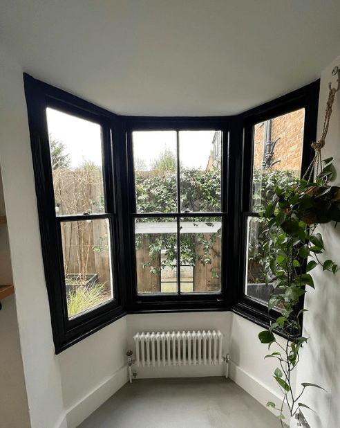 He has painted his bay window frame black and fitted new radiators