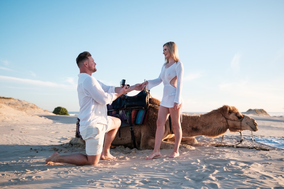 The pair posed in front of a camel to celebrate their special moment