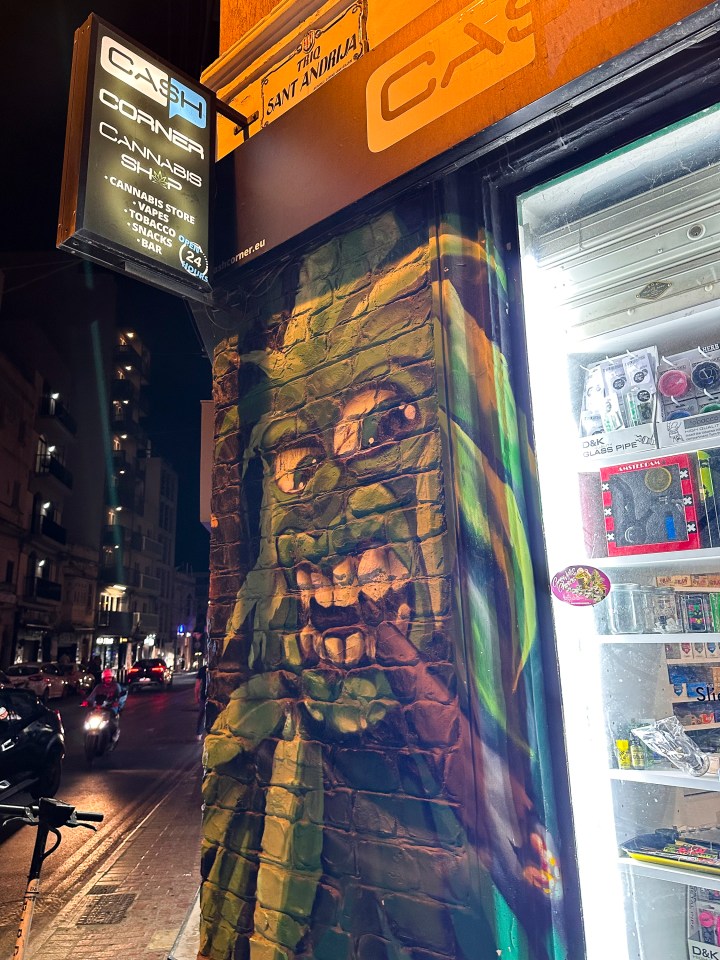 Many of the stores selling cannabis are covered in themed artwork