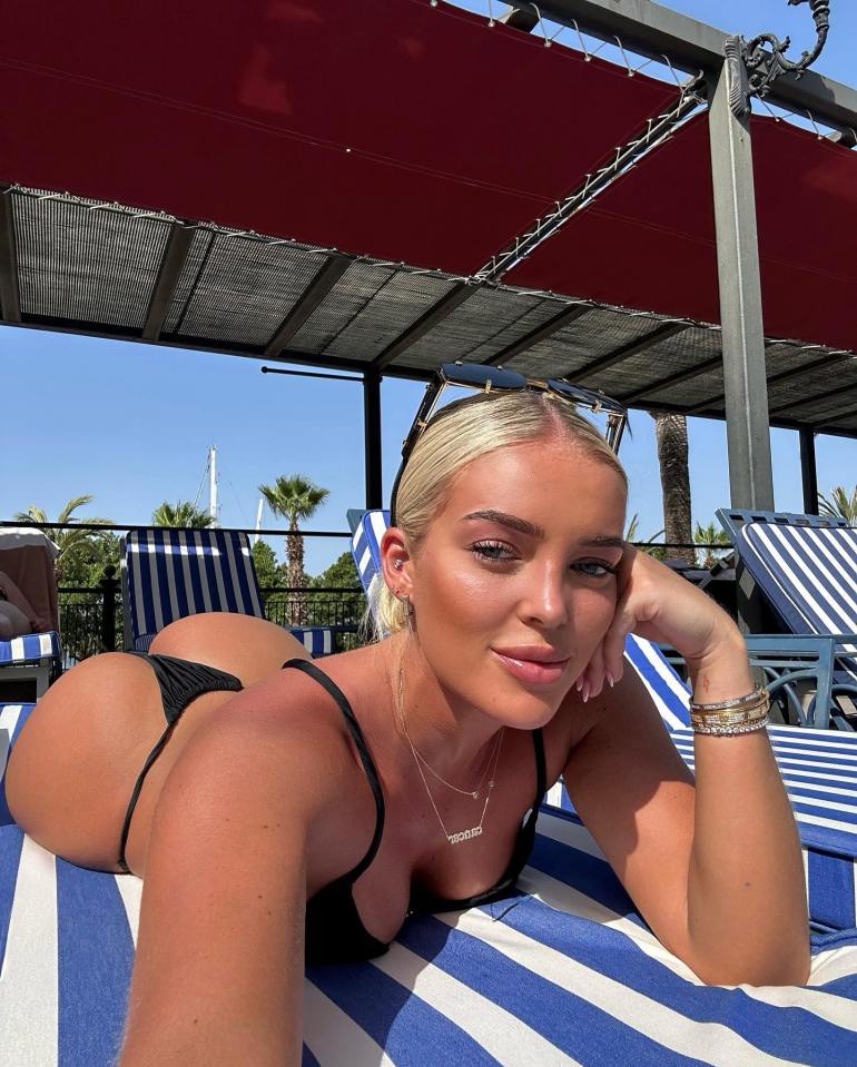 Love Island's Mary Bedford flashed her bum as she posed in a black thong bikini