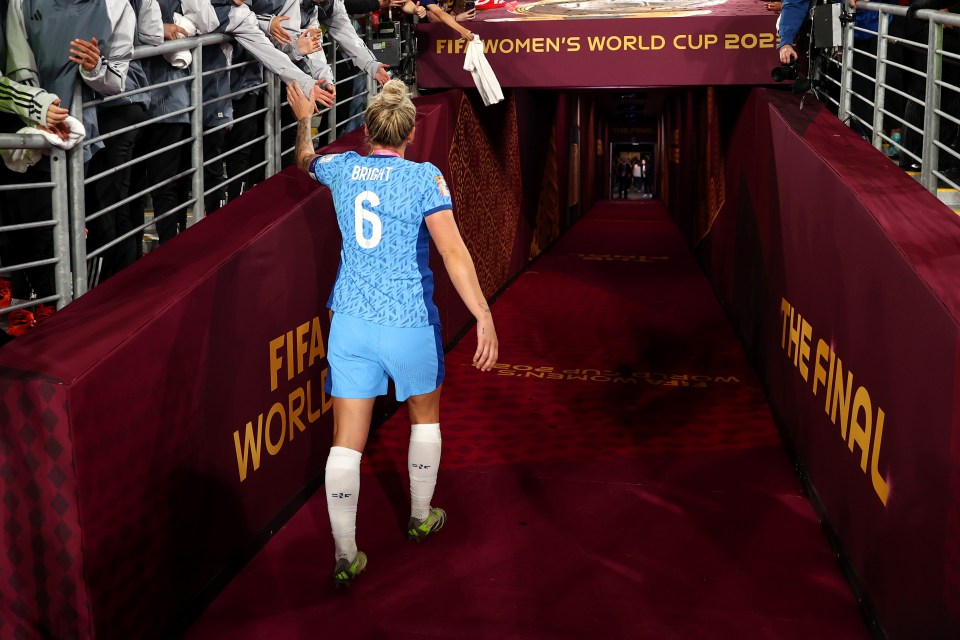 Millie Bright shakes hands with fans as she walks down the tunnel after the Women's World Cup final