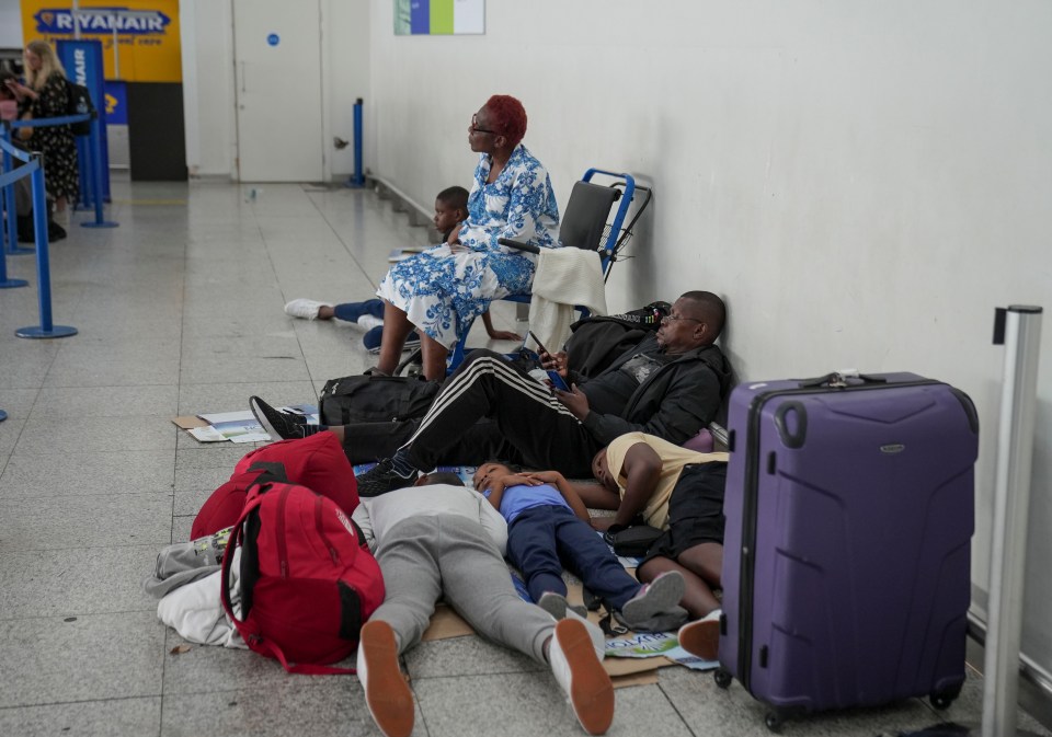 Grim scenes at Stansted Aiport on Tuesday saw families hunkering down on the floor