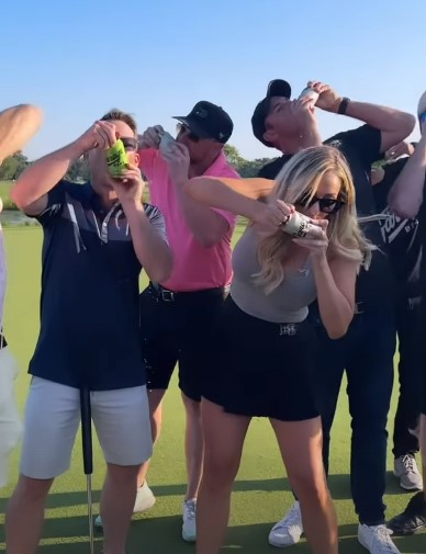 From beer to return tee - Paige awed onlookers by downing a can before she wowed with her golf