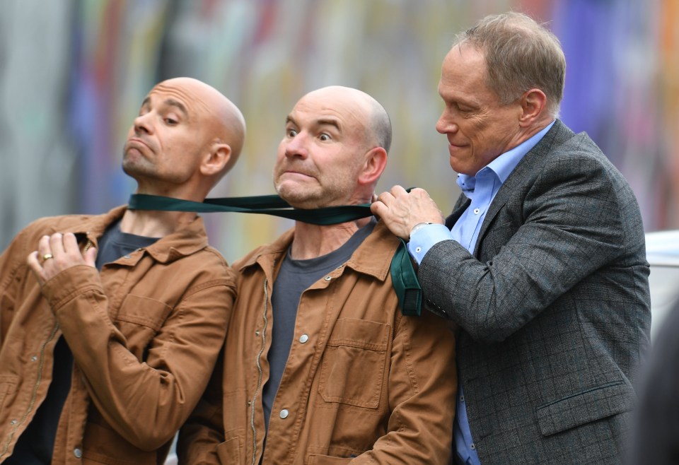 The actors lark about with Tim's stunt double behind the scenes