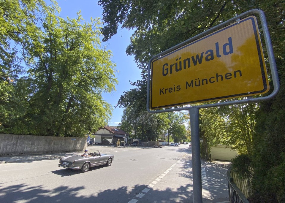 There are a number of sports cars that line the streets in Grünwald