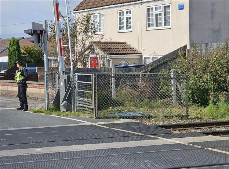 A police officer is in hospital after being hit by a train