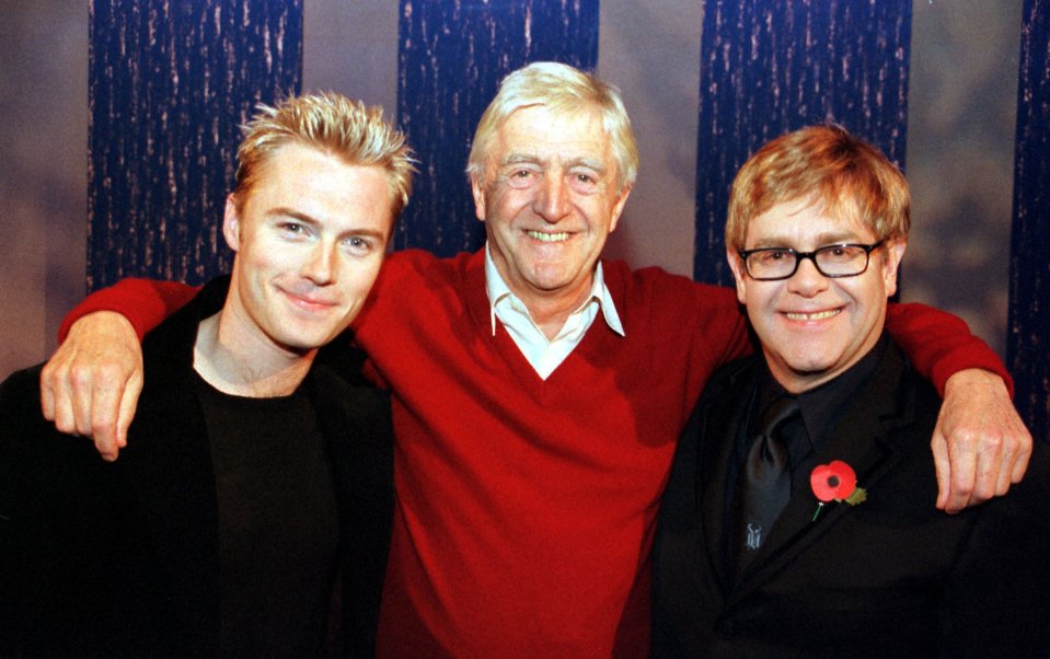 Michael seen here with Ronan Keating (left) and Sir Elton John, who paid a touching tribute to his friend