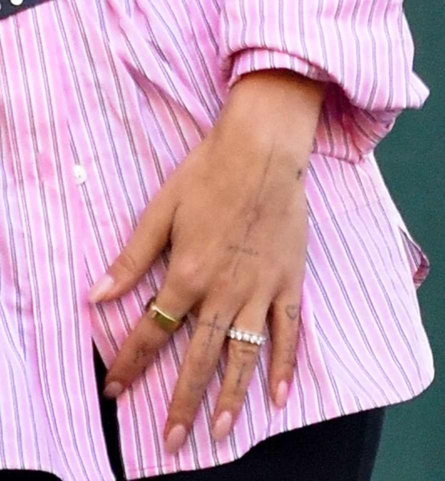 Her wedding ring could be seen as she stepped out