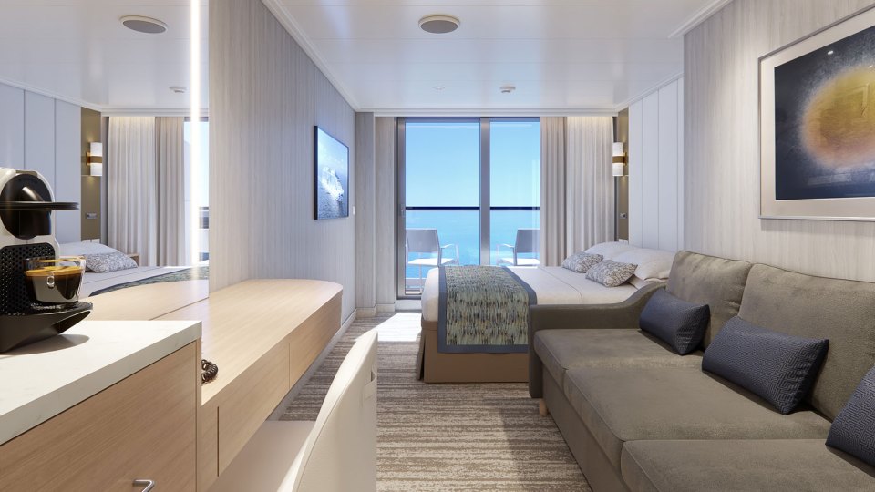 Unwind in style and comfort in the Deluxe Balcony Stateroom.