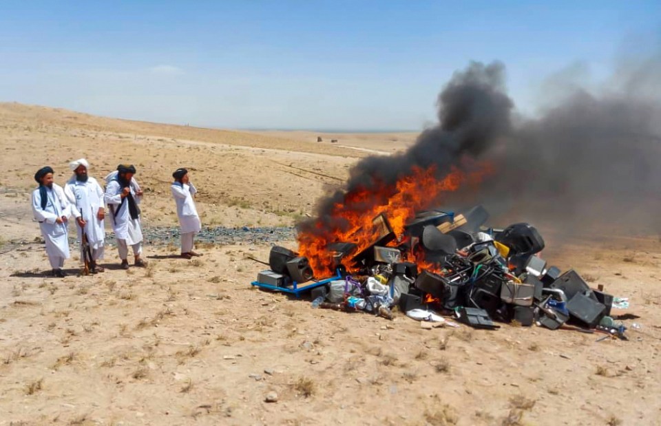 Taliban members burn music equipment in their latest clampdown on instruments