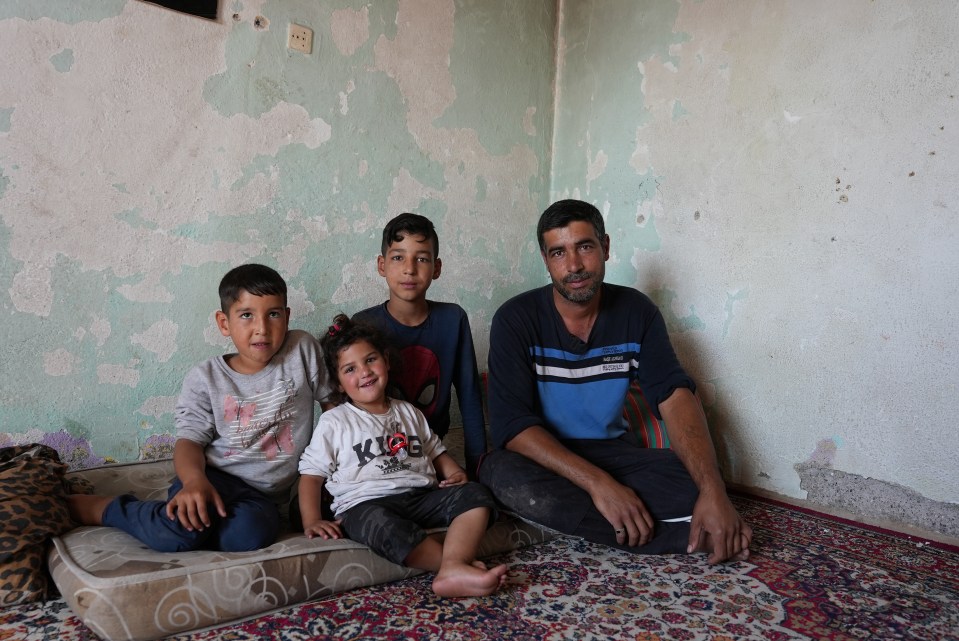 Construction worker Emrah Konac had to flee his family home with sons Sahin, left, and Orhan, and daughter Zeynep