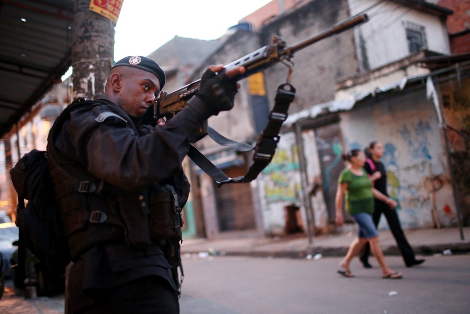 A Brazilian military police officer patrols the 'favelas'