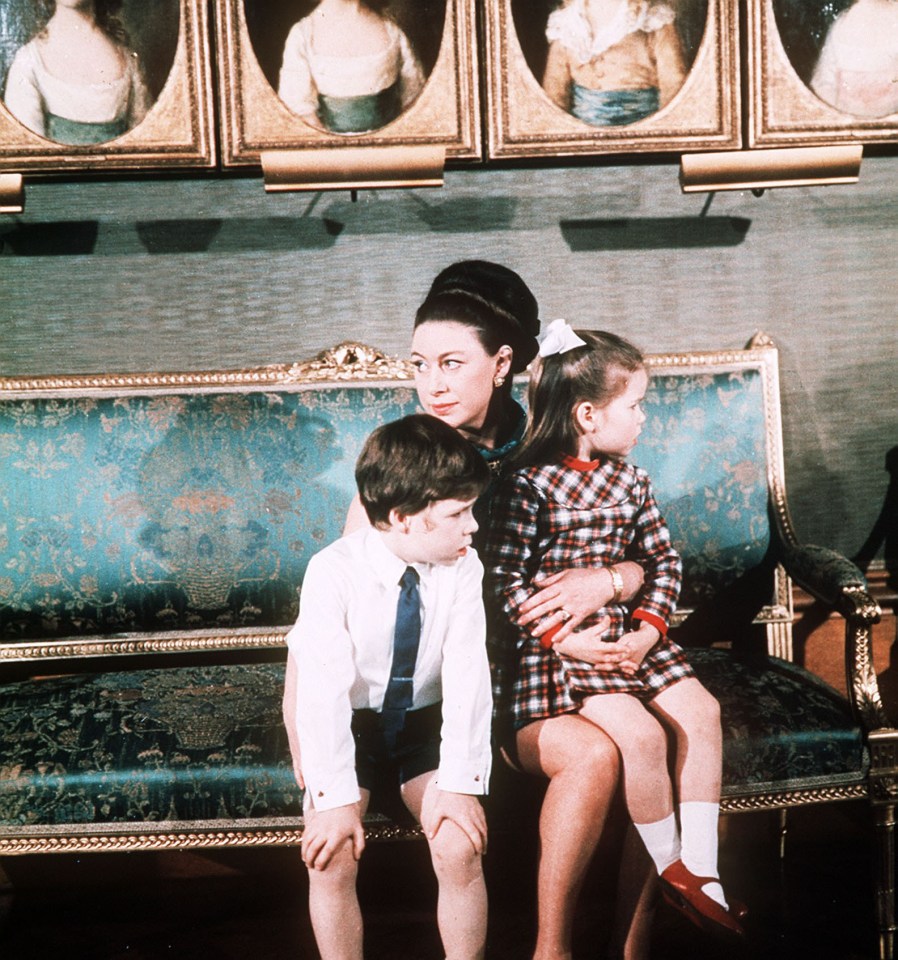 The royal is seen here as a child with her mother and brother