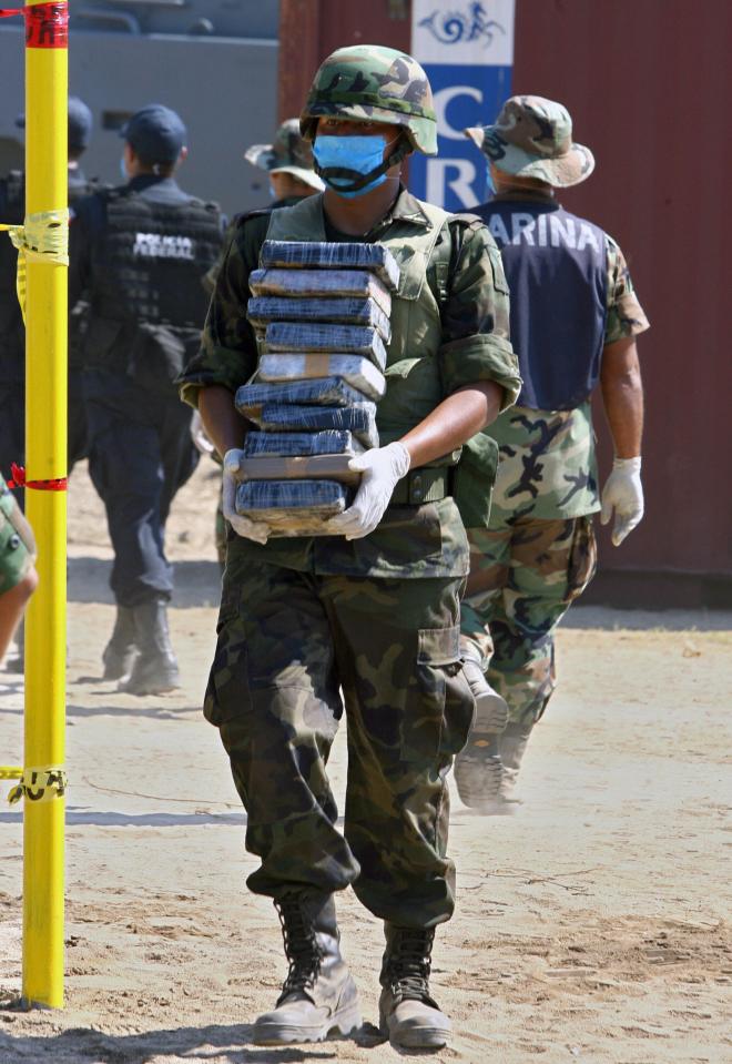 A Mexican soldier carries drug packages before the incineration of 23,5 tons of cocaine in Manzanillo