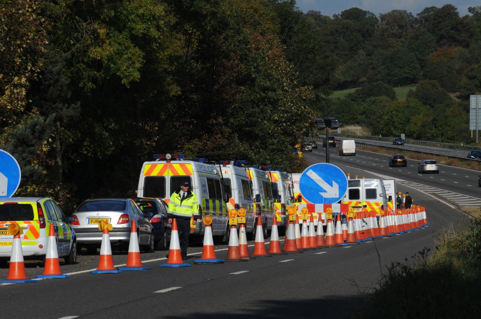 Police on the M5 sliproad where a body was found in 2009