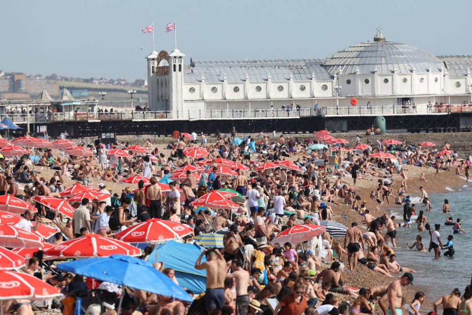 Brighton beach is packed with visitors as temperatures soar