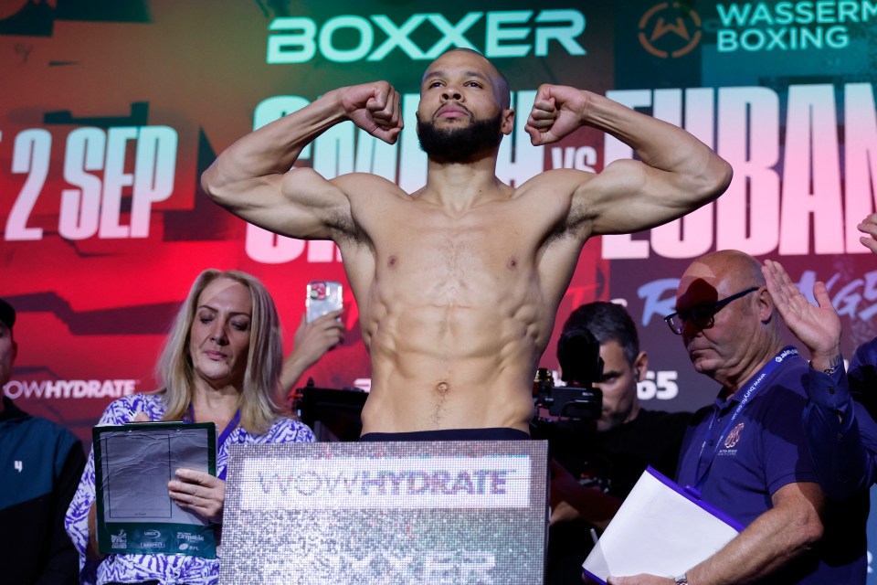 Eubank Jr flexes on stage at the weigh in