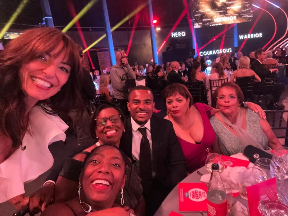 Awards host Davina McCall with the group of representatives receiving the Christina Newbury Memorial Award in honour of the Windrush Generation’s contribution to the NHS