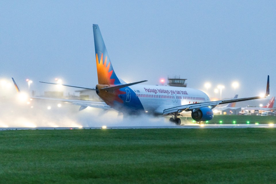 A Jet2 aircraft taking off in the pouring rain this morning at Leeds Bradford Airport, Yorkshire