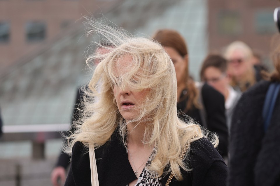 Commuters battled with strong winds in London today