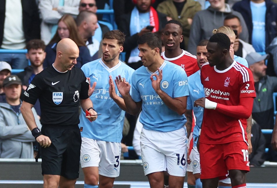 Players from both sides swarmed the ref following the incident