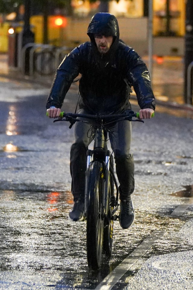 Commuters were soaked in Manchester city centre this morning