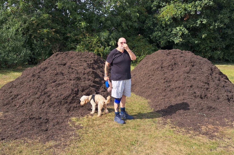 Frank Mcarthur in front of the waste piles